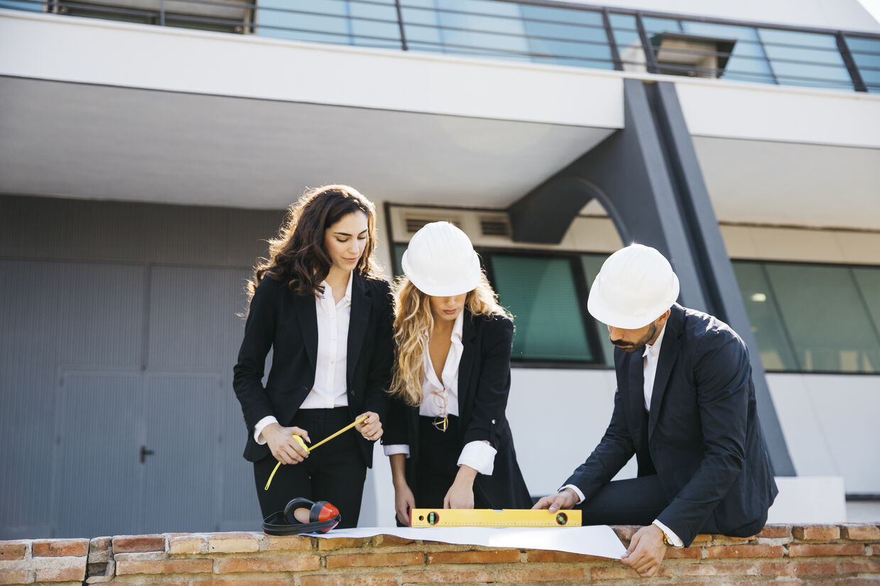 three architects wearing helmets_optimized_300